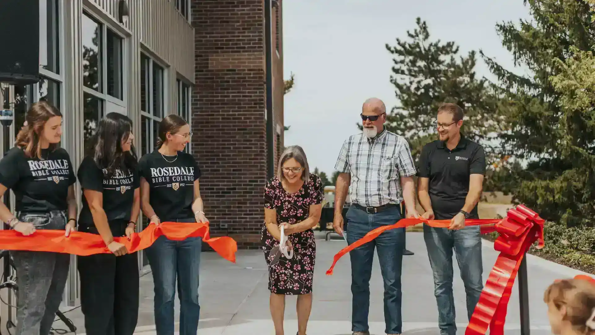 Rosedale Bible College exterior ribbon cutting church building